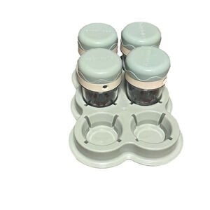 Baby bullet food storage 4 jars and a tray .